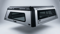The Weekender — galvanized manganese steel cap with glass sliding-window sides, hero angle